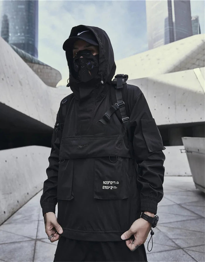 Person wearing a black outfit with a hood and backpack in an urban setting
