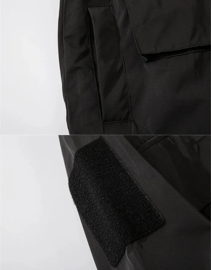 Close-up of a black jacket with textured fabric on a white background