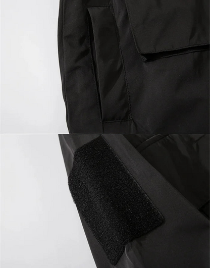 Close-up of a black jacket with textured fabric on a white background