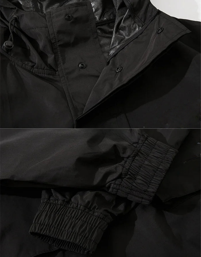 Close-up of a black jacket with buttons and cuffs on a dark background
